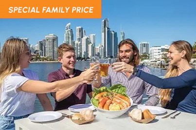 Guests enjoying a wholesome lunch set against the stunning backdrop of Gold Coast skyline