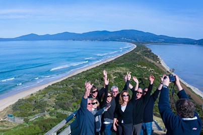 A group of people posing for a photo on Bruny Island.
