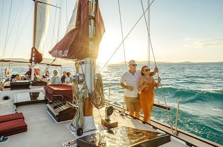 Guests enjoying a glorious sunset aboard the Lady Enid Sunset cruise