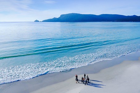 A group of people posing for a photo on Bruny Island.