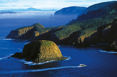 People enjoying the rugged coastline of Bruny Island.