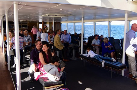Guests admiring the stunning hobart scenery from the comfort of a luxurious catamaran