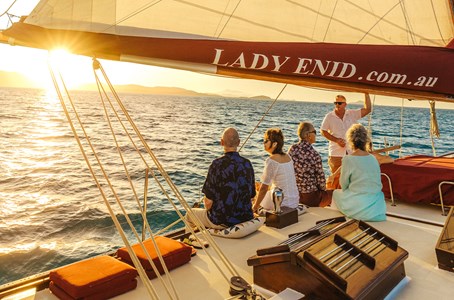 Guests enjoying a glorious sunset aboard the Lady Enid Sunset cruise