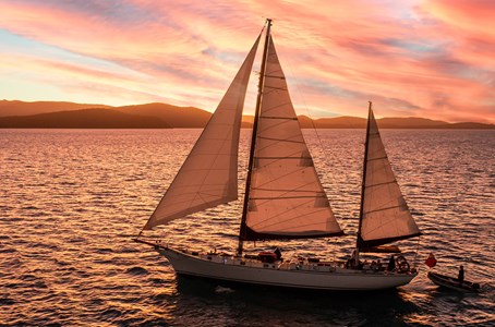 Guests enjoying a glorious sunset aboard the Lady Enid Sunset cruise