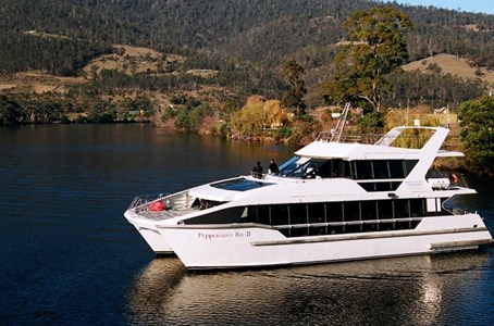 Guests admiring the stunning hobart scenery from the comfort of a luxurious catamaran