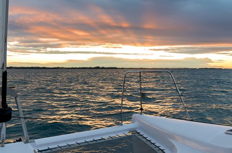 A luxury sailing yacht cruising along the waters off Moreton Island